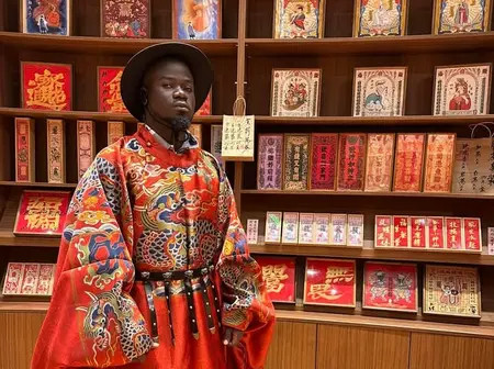 How Kenyans Reacted to Mulamwa’s outfit in Chinese clothes while in China
